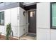 Close-up of the front door with modern hardware and stylish exterior lighting at 5 Seawell Ave # 106, Raleigh, NC 27601