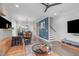 View of living room showing an open floor plan with dining area, modern furnishings, and natural light at 5 Seawell Ave # 106, Raleigh, NC 27601