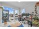 Bright home office with large windows offering city views, desk space, and plants for a productive work environment at 5 Seawell Ave # 106, Raleigh, NC 27601
