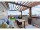 Inviting rooftop deck featuring a pergola, cozy seating, and a modern outdoor table perfect for entertaining at 5 Seawell Ave # 106, Raleigh, NC 27601