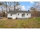 Back exterior view of the home with fenced in yard at 5144 Shield Cir, Raleigh, NC 27603
