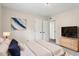 Well decorated bedroom with an abstract painting, and complemented by modern furniture at 5144 Shield Cir, Raleigh, NC 27603