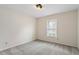 Bright bedroom features a ceiling light fixture and a window offering natural lighting at 5144 Shield Cir, Raleigh, NC 27603