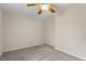 Neutral bedroom with plush carpet, neutral walls, and a modern ceiling fan at 5144 Shield Cir, Raleigh, NC 27603