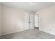 Clean bedroom with carpet and doors leading to a bathroom, and closet space at 5144 Shield Cir, Raleigh, NC 27603