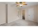 Bright bedroom with neutral carpet, doors, trim, and featuring access to a private bathroom at 5144 Shield Cir, Raleigh, NC 27603
