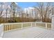 White deck railing overlooks spacious backyard and mature trees at 5144 Shield Cir, Raleigh, NC 27603