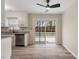 Bright dining area boasts modern flooring, neutral walls, and sliding glass doors to the outdoor deck at 5144 Shield Cir, Raleigh, NC 27603