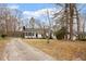 Charming single Gathering house with long driveway and a well-manicured lawn at 5144 Shield Cir, Raleigh, NC 27603