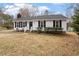 Charming single Gathering home with a well-maintained front lawn at 5144 Shield Cir, Raleigh, NC 27603
