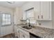 Classic kitchen design offers granite countertops, stainless steel sink, and lots of cabinet space at 5144 Shield Cir, Raleigh, NC 27603