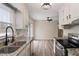 Spacious kitchen boasts granite countertops, stainless steel appliances, and stylish finishes at 5144 Shield Cir, Raleigh, NC 27603