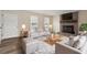 Inviting living room features stylish decor, a cozy fireplace, and lots of natural light at 5144 Shield Cir, Raleigh, NC 27603