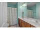 Stylish bathroom with double sink vanity, large mirror, and a tub with a shower curtain at 515 Littleport Dr, Rolesville, NC 27571