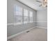 Bright bedroom with neutral carpet, a ceiling fan, and large windows at 515 Littleport Dr, Rolesville, NC 27571