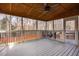 Spacious screened-in porch with wood ceiling, overlooking a wooded backyard at 515 Littleport Dr, Rolesville, NC 27571
