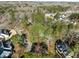 Aerial view of a residential neighborhood in a wooded setting at 5413 Leopards Bane Ct, Holly Springs, NC 27540