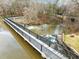 Scenic aerial view of the dam, showcasing the natural landscape and spillway at 5413 Leopards Bane Ct, Holly Springs, NC 27540