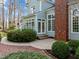 Exterior of home featuring light blue siding, a brick chimney, white trim, and landscaping at 5413 Leopards Bane Ct, Holly Springs, NC 27540