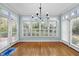 Bright dining room featuring large windows and plantation shutters; ready for your personal touches at 5413 Leopards Bane Ct, Holly Springs, NC 27540