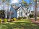 Charming two-story home with a manicured lawn, mature landscaping and a traditional architectural style at 5413 Leopards Bane Ct, Holly Springs, NC 27540