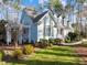 Side view of a charming home with well-manicured landscaping and distinctive architectural details at 5413 Leopards Bane Ct, Holly Springs, NC 27540