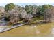 Charming waterfront home with a picturesque view, lush lawn, and a private bridge at 5413 Leopards Bane Ct, Holly Springs, NC 27540