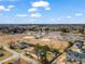 Aerial view showcasing the neighborhood, local park and amenities surrounding the property at 561 Circle Dr, Angier, NC 27501