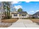 Charming single-story home with a welcoming front porch and well-maintained landscaping at 561 Circle Dr, Angier, NC 27501