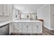 Bright kitchen features white cabinets, stone countertops and stainless steel appliances at 561 Circle Dr, Angier, NC 27501