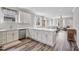 Modern kitchen with white cabinetry, stainless steel appliances, and hardwood floors at 561 Circle Dr, Angier, NC 27501