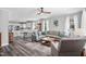 Open-concept living room with hardwood floors, comfortable seating, and lots of natural light at 561 Circle Dr, Angier, NC 27501