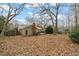 Spacious backyard with mature trees and a deck, perfect for outdoor entertaining at 5815 Windham Dr, Raleigh, NC 27609