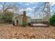 Backyard featuring a small deck and green lush trees at 5815 Windham Dr, Raleigh, NC 27609