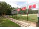 Well-maintained baseball field with stands and banners showcasing team achievements at 5815 Windham Dr, Raleigh, NC 27609