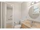 Well-lit bathroom features a vanity, toilet, and a shower/tub combo with safety bars at 5815 Windham Dr, Raleigh, NC 27609
