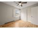 Bedroom with hardwood floors, ceiling fan, and a bright window at 5815 Windham Dr, Raleigh, NC 27609