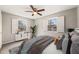 Bright bedroom with two windows, wood floors and contemporary decor at 5815 Windham Dr, Raleigh, NC 27609