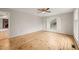 Spacious bedroom with hardwood floors, and a large window at 5815 Windham Dr, Raleigh, NC 27609