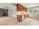 Bright kitchen features wood cabinets, stainless appliances, and tile floors at 5815 Windham Dr, Raleigh, NC 27609