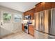 Kitchen with stainless steel appliances, wood cabinets, and a door to the outside at 5815 Windham Dr, Raleigh, NC 27609