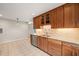 Kitchen with stainless steel appliances, wood cabinets, and granite countertops at 5815 Windham Dr, Raleigh, NC 27609