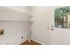 Well-organized laundry area featuring wooden vinyl floors and storage space at 5815 Windham Dr, Raleigh, NC 27609