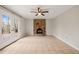 Living room with a brick fireplace and French doors leading to a deck at 5815 Windham Dr, Raleigh, NC 27609