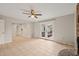 Living room with French doors leading to the outside, and an open kitchen and hallway at 5815 Windham Dr, Raleigh, NC 27609