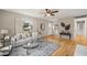 Inviting living room with hardwood floors, light gray walls, and modern furnishings at 5815 Windham Dr, Raleigh, NC 27609