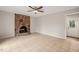 Cozy living room featuring a brick fireplace and tile flooring at 5815 Windham Dr, Raleigh, NC 27609