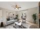 Open-concept living room with view of dining area, and access to back patio at 5815 Windham Dr, Raleigh, NC 27609