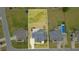 A bird's-eye view shows a beautiful home, a well-maintained yard, and the neighborhood at 5820 Brayton Park Pl, Holly Springs, NC 27540