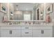 Bathroom with a double vanity, sleek fixtures, and contemporary design at 5820 Brayton Park Pl, Holly Springs, NC 27540